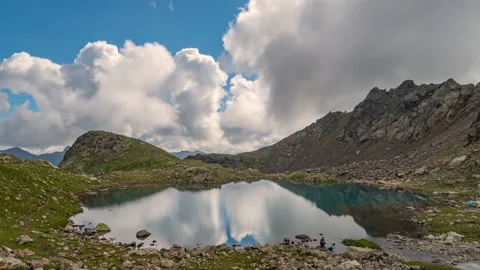 Clouds reflection in high mountain lake. Stock Footage 142026355
