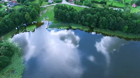 Clouds reflections on lake surface aerial Stock Footage 66433768