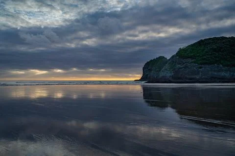 Clouds reflections at the Te Henga Beach Stock Photos