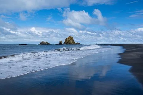 Clouds reflections at Whatipu Beach Stock Photos