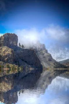 Clouds rest on the mountains Stock Photos