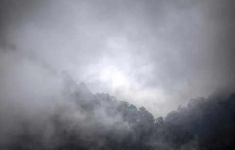 Clouds rest on the mountains Stock Photos