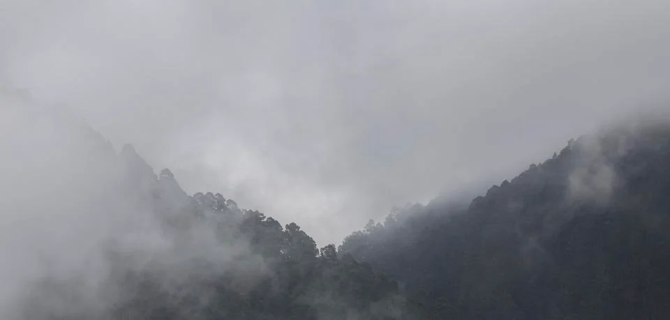 Clouds rest on the mountains Stock Photos