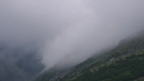 Clouds rise up the mountain side. Timelapse. Subpolar Ural. Uralic Mountains Stock Footage 269143313