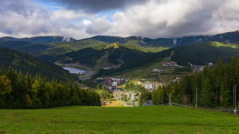 Clouds rise from the mountains after rain on a sunny autumn day at a ski reso Stock Footage 217915289