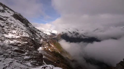 Clouds rising up mountain side time-lapse. Stock Footage 49796136
