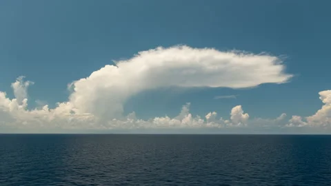 Clouds rising over the ocean from a boat Stock Footage 154911282