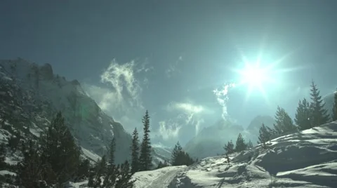 Clouds Rising to Snowy Mountain High Peaks Stock Footage 59776309