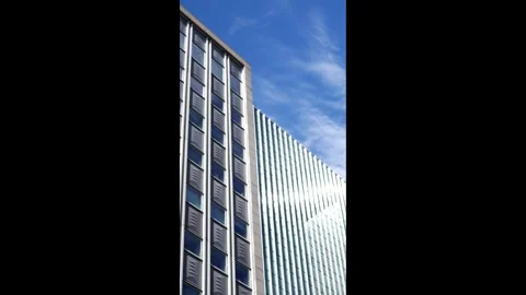 Clouds Roll By Corporate Skyscraper 2 Stock Footage 327047446