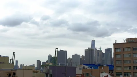 Clouds roll over Brooklyn and the downtown Manhattan skyline Stock Footage 61808823