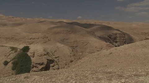 Clouds roll over canyons in Negev desert Stock Footage 86759496