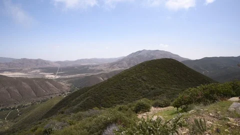 Clouds roll over a hillside Stock Footage 102190904