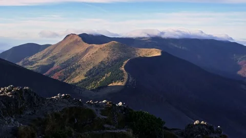 Clouds roll over the mountain ridge, Autumn morning in Carpathian nature Stock-Footage 254546917