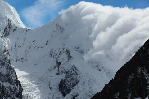 Clouds roll thru the andes mountains Stock Photos