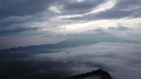 Clouds Rolling Around Mountain Peak at Sunrise in Bali Indonesia Stock-Footage 345216938