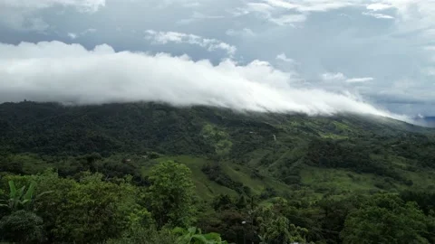 Clouds Rolling Down the Mountains Sped Up Stock Footage 216239950