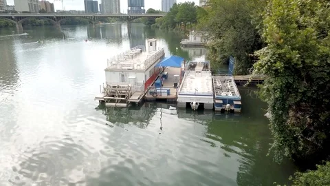 Clouds rolling into downtown Austin, TX reflect off the waters of Town Lake Stock Footage 109173981