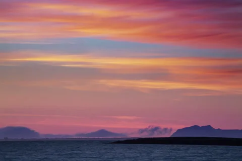Clouds rolling in during vibrant afterglow Stock Footage 67385891