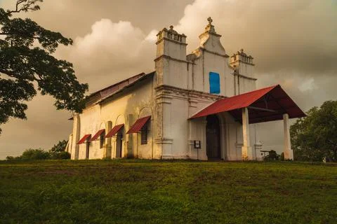 Clouds rolling in on an old chapel Stock Photos