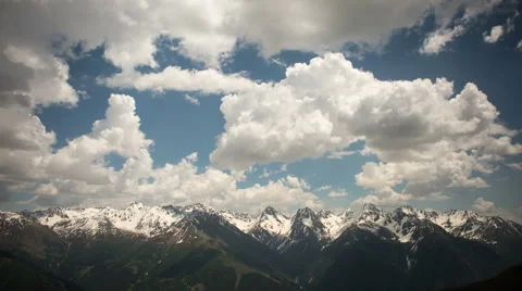 Clouds rolling over alpine landscape Stock Footage 44481639