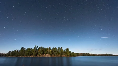 Clouds Rolling in Over Fourtown Lake in the middle of the Night Stock Footage 123990424