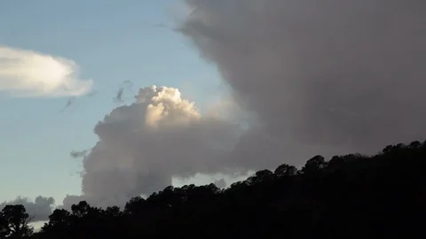 Clouds rolling over horizon at sunset Stock Footage 104876829