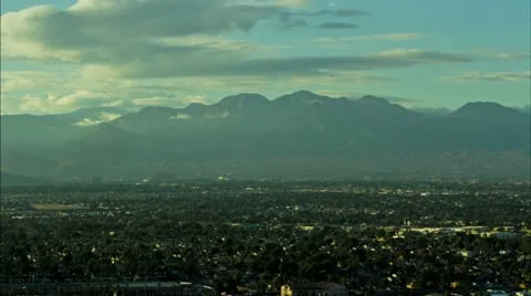 Clouds Rolling Over Las Vegas Mountain Range and City Sunset Time Lapse Stock Footage 20543710