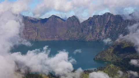 Clouds rolling over Mount Rinjani caldera in Lombok Stock Footage 332057060