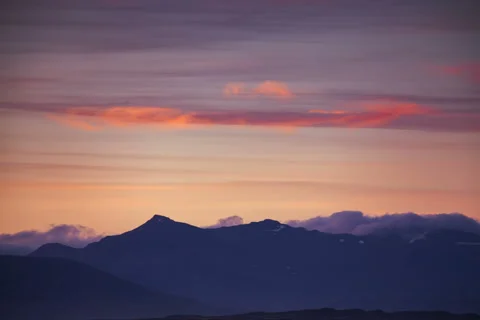 Clouds Rolling Over Mountain After Sunset Stock Footage