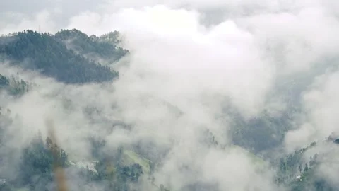 Clouds Rolling Over Mountain Slopes Stock Footage 316891238