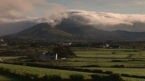 Clouds rolling over a mountain top in Ireland Stock Footage 643919