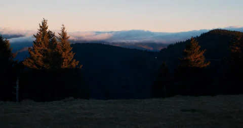 Clouds rolling over scenic mountains at sunset in 4k Stockbeeldmateriaal 144449379