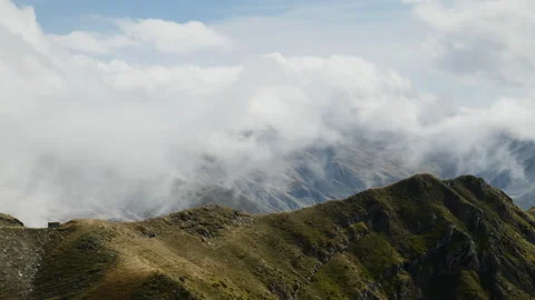 Clouds Rolling Over the Tzoumerka Mountains in Daylight Stock Footage 333986664