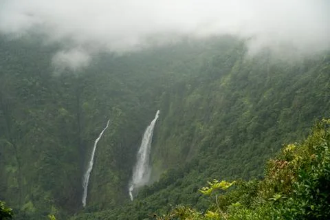 Clouds rolling in over the waterfalls Stock Photos