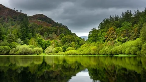 Clouds rolling over Yew Tree Tarn in Lake District Stock Footage 144334956