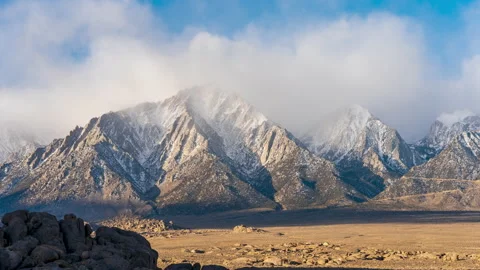 Clouds Rolling Through Mountains Stock Footage 153629930