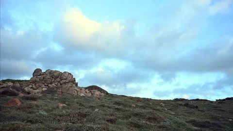 Clouds run fast in a landscape of wild nature Stock Footage 104988234
