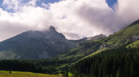 Clouds run over epic mountain timelapse Stock Footage 41629546