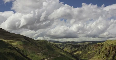 Clouds running above green landscape Video stock 79605229