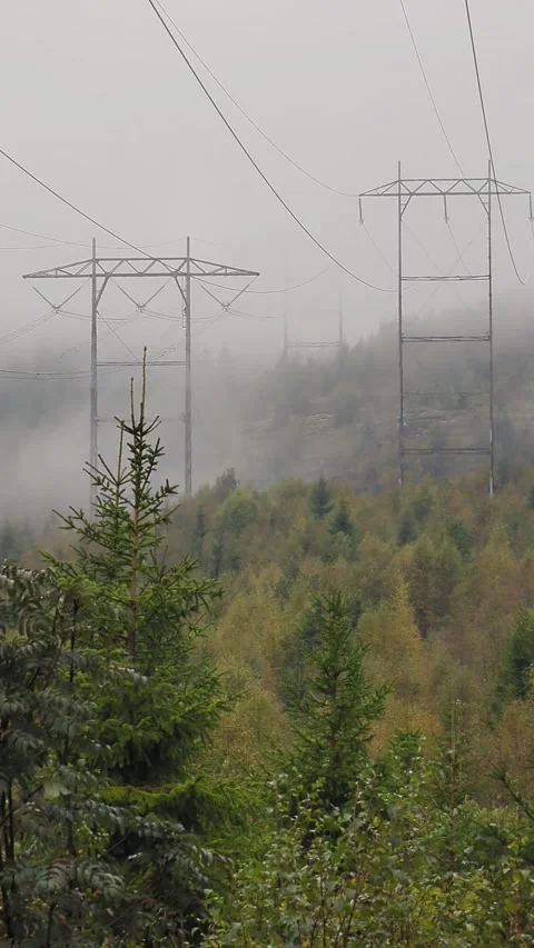 Clouds running by electrical poles on windy day in norway Stock Footage 259303793