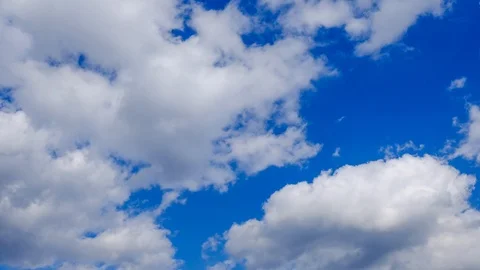 Clouds running over blue sky. 4k timelapse video of white clouds over blue sk Stock Footage 102438124