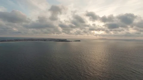 Clouds running over the ocean, shooting from a drone Stock Footage 105125538