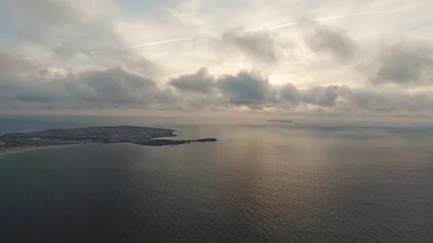 Clouds running over the ocean, shooting from a drone Stock Footage 105125576