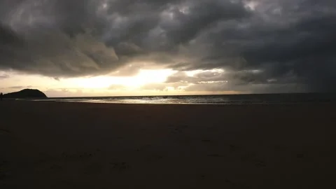 Clouds rushing past the beach in the early morning. Timelapse Stock Footage 280027327