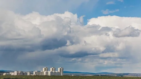 Clouds sailing above a city Video stock 76364991