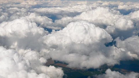 Clouds seen from flying plane. Skyscape with cloud from the plane window midair Stock Footage 126360767