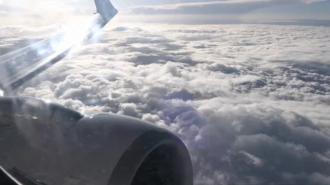 Clouds seen from plane, passenger seat, window, pov, engine, wing Stock Footage 90113795