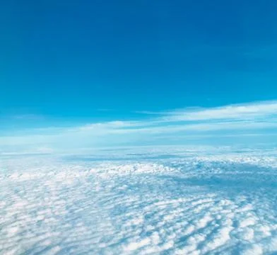 Clouds seen through an airplane window Stock Photos