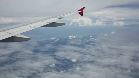 Clouds seen through the window of jet airplane Stock Footage 51667071