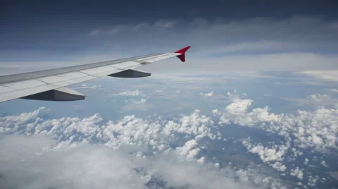 Clouds seen through the window of jet airplane Stock Footage 51667237